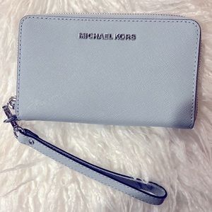 NWOT Michael Kors wristlet wallet.  Beautiful blue/gray color.  Never used.